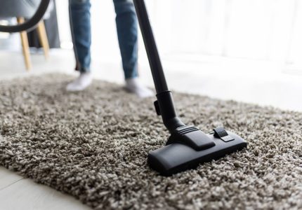 people-housework-housekeeping-concept-close-up-woman-with-legs-vacuum-cleaner-cleaning-carpet-home (1)